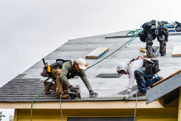 Professional Roofing technician working in Norton, MA